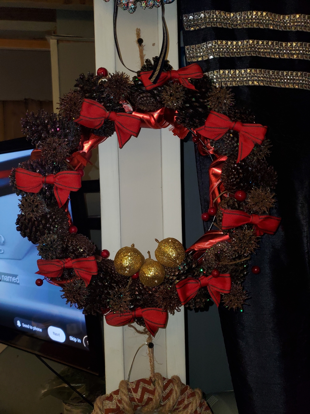 Handcrafted Festive Pinecone Christmas Wreath with Red Bows and Gold Ornaments
